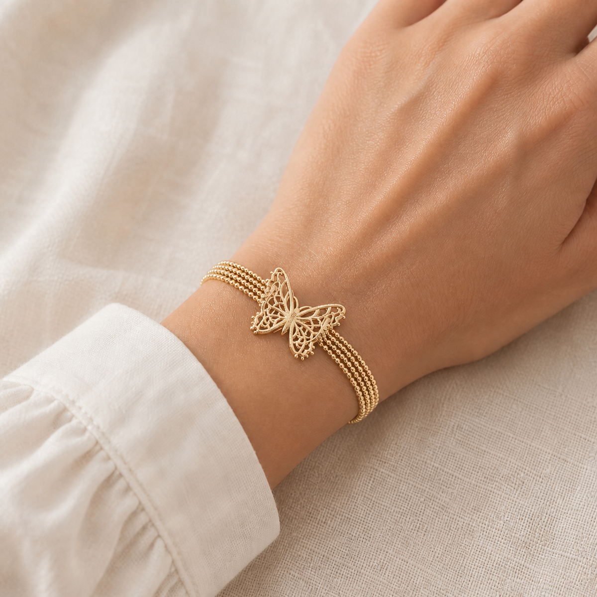 Butterfly Lace Bracelet – 925 sterling silver with 18K gold plating, worn by a model