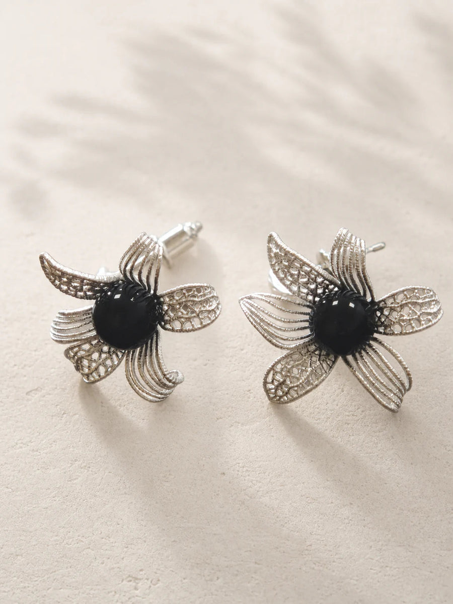 Noir Bloom floral earrings with dark center stones