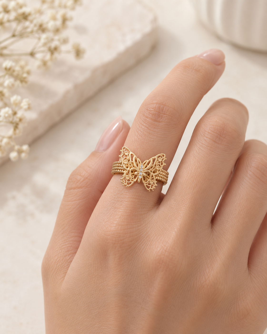 Butterfly Lace Adjustable Ring worn on a finger, showing the open-band design.